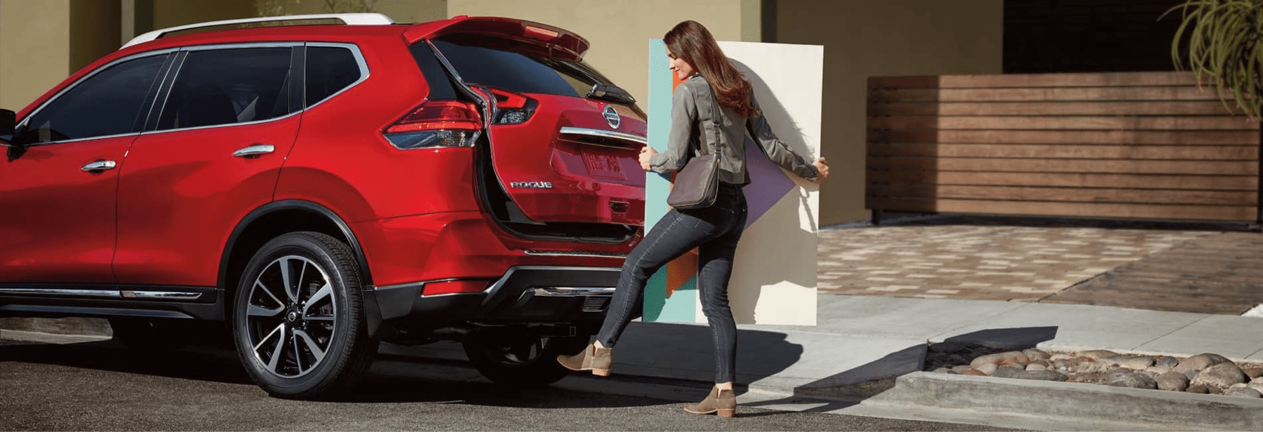 woman opens Nissan rogue liftgate with foot