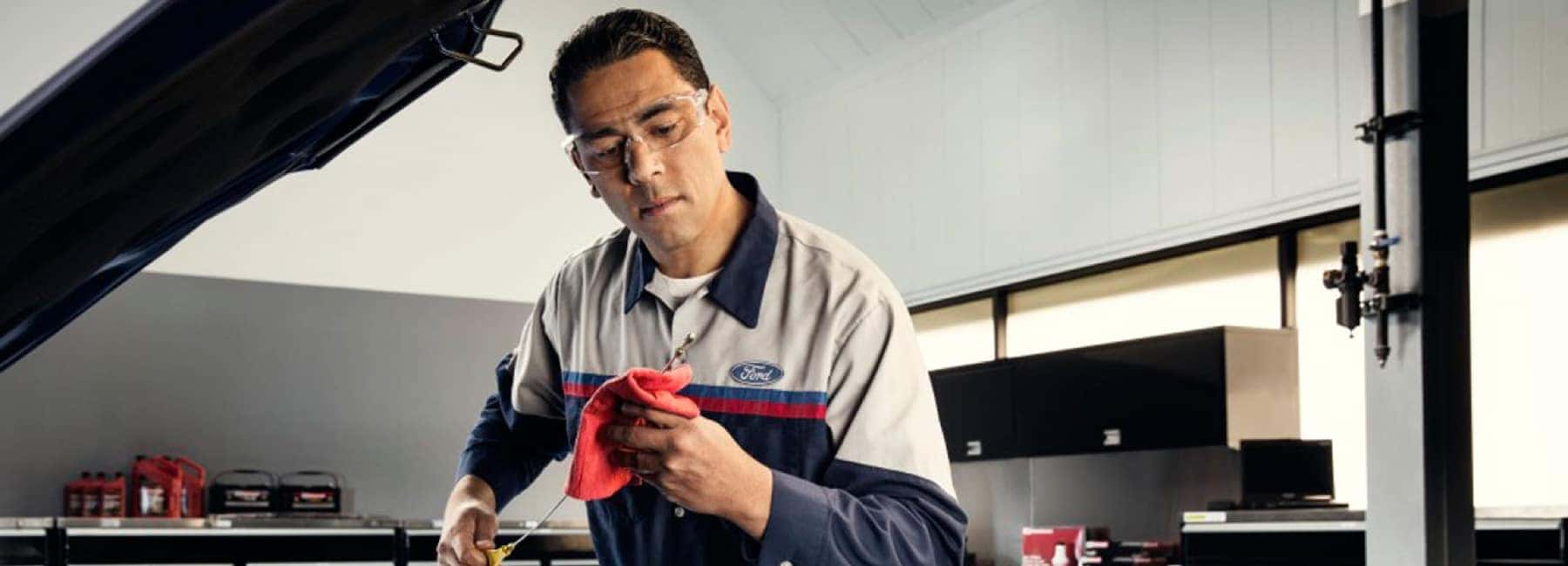ford-mechanic-checking-oil