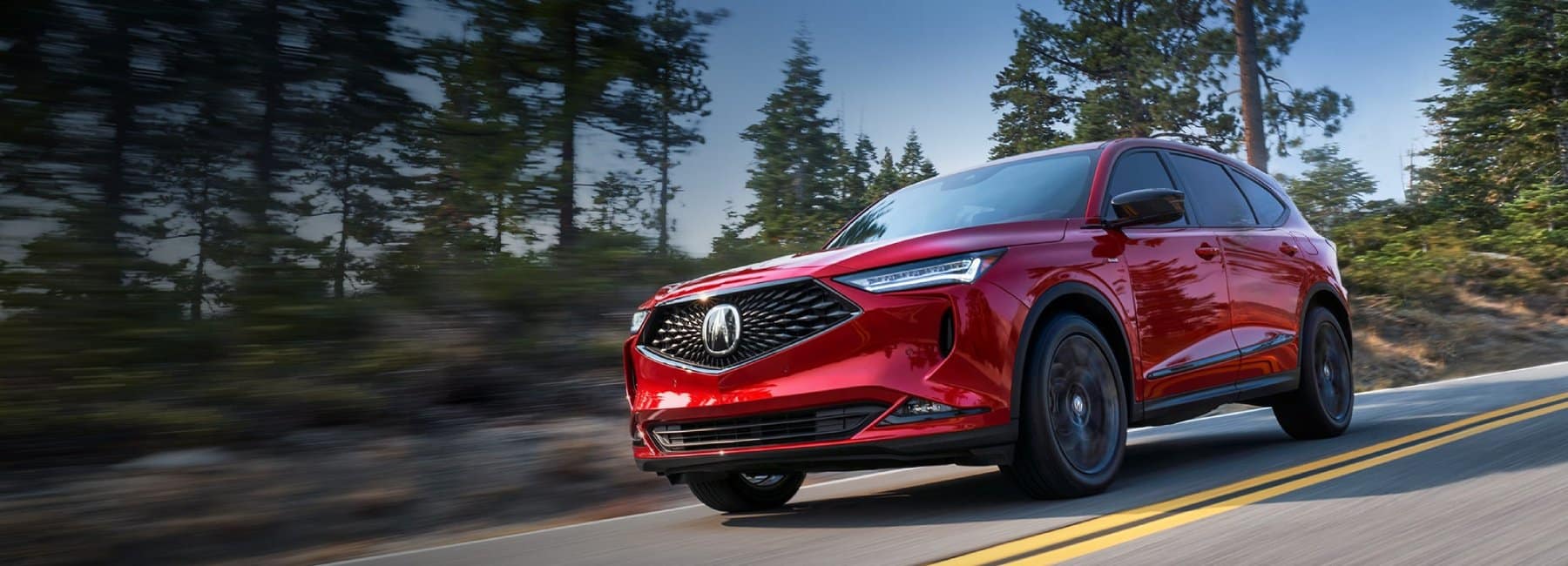 2022-Acura-MDX-red-in-forest-road