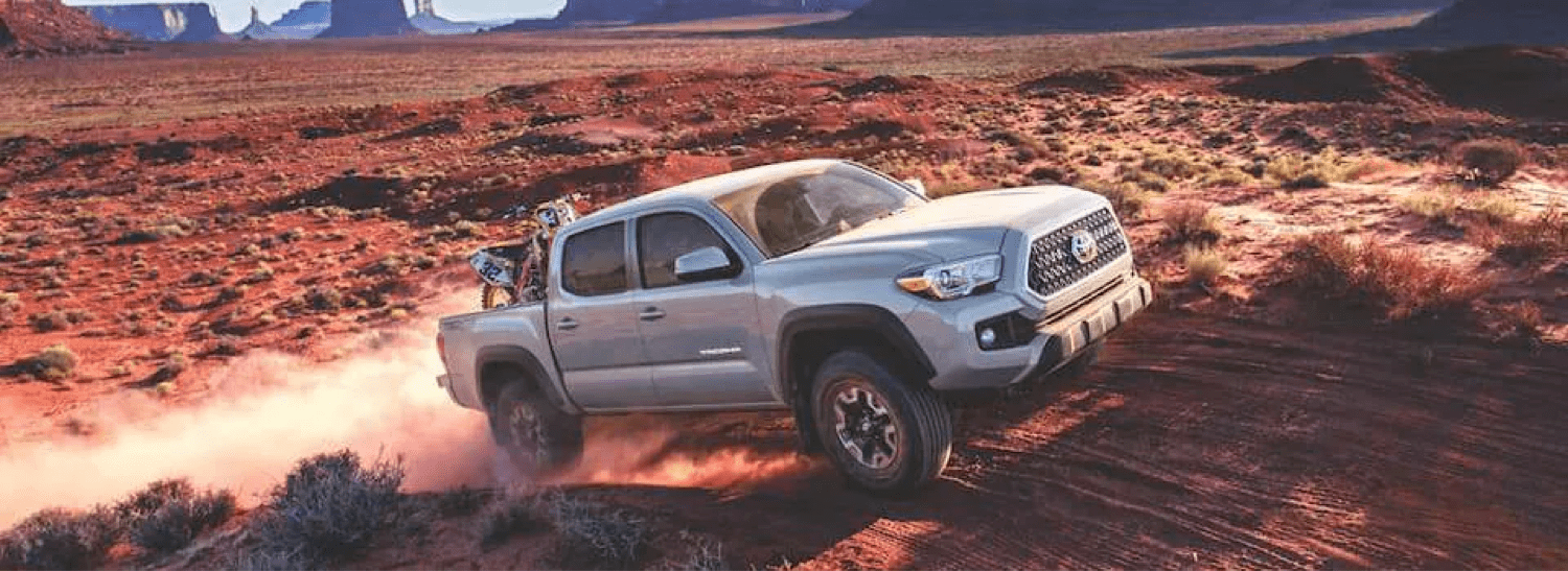 2019-Toyota-Tacoma-drives-red-dirt-road