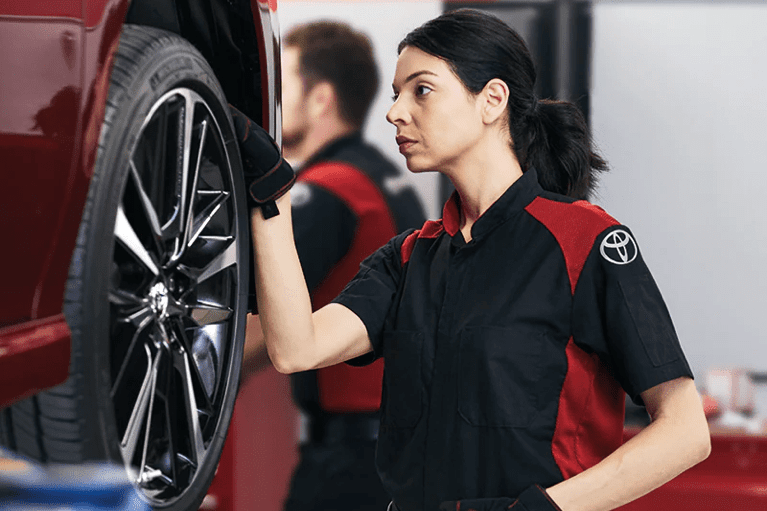 toyota-technician-checks-tire-pressure