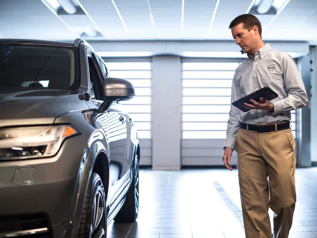 Man Looking At Car