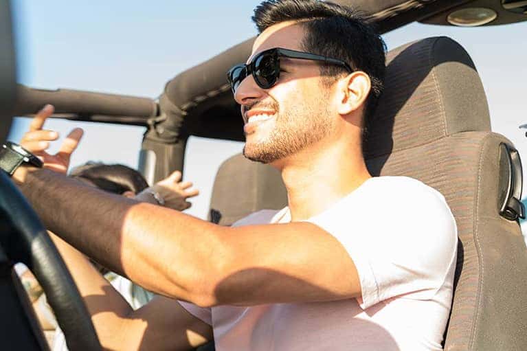 Happy passengers in an open air offroading vehicle