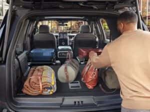 View of man packing things into cargo area of 2025 Ford Expedition 