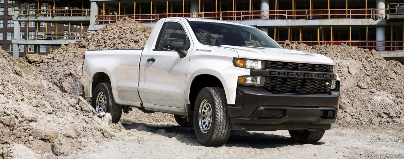 A white 2020 Chevy Silverado 1500 WT is parked at a construction site.