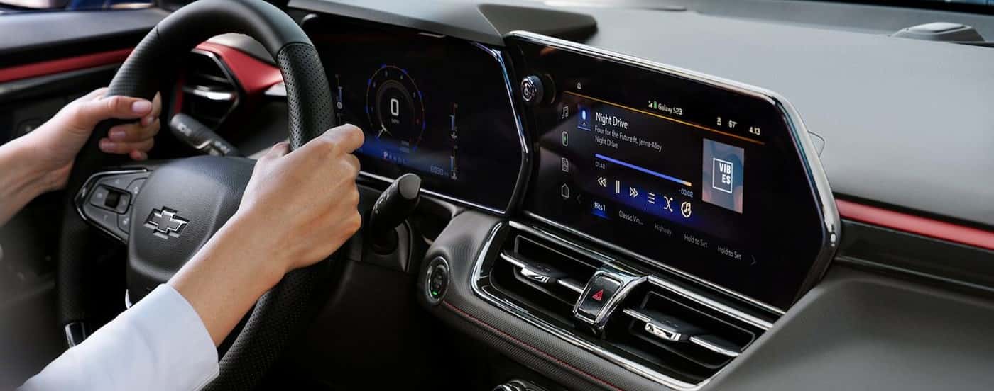 A close-up of the black dash is shown in a 2025 Chevy Trailblazer for sale.