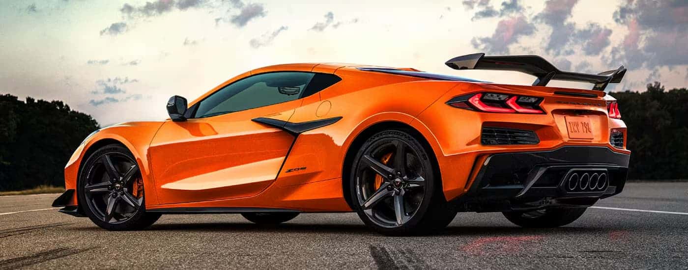 Side view of an orange 2025 Chevy Corvette for sale near me.