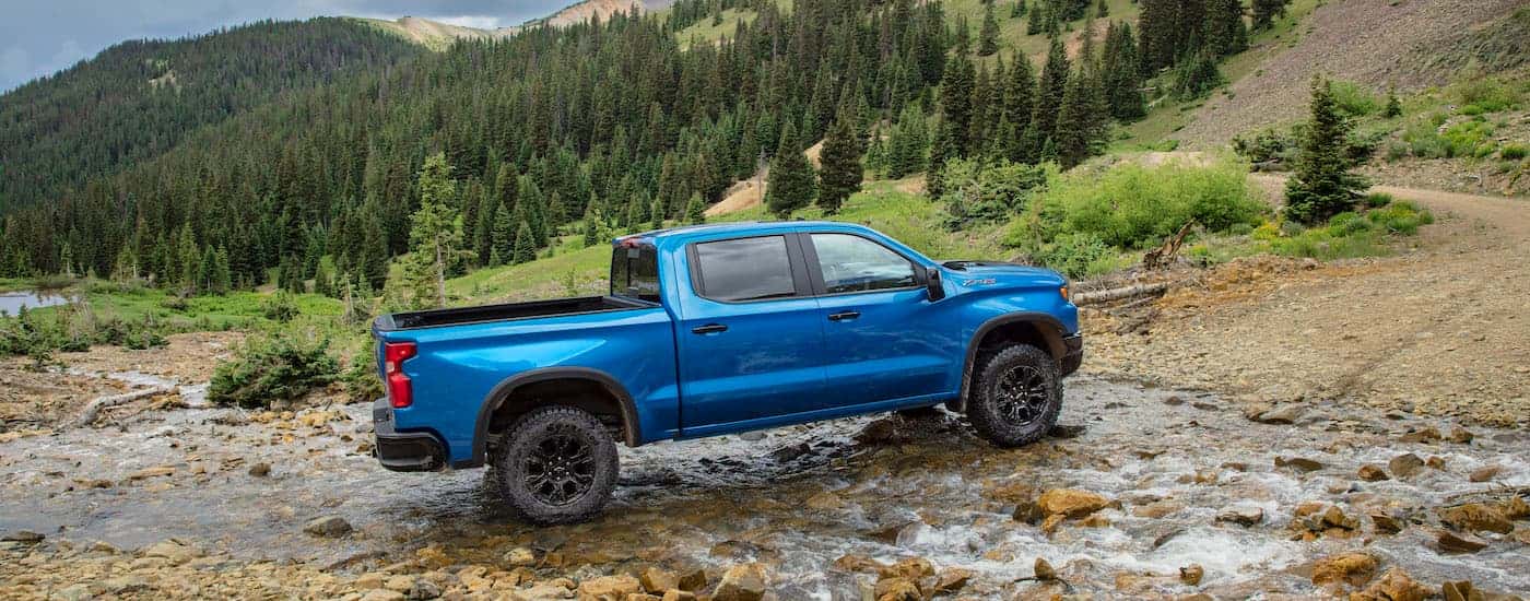 A blue 2025 Chevy Silverado 1500 ZR2 is shown from the side after leaving a dealer that has a Chevy Silverado for sale near Dover.
