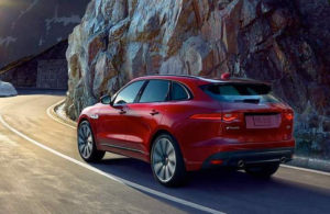rear view of a red 2018 Jaguar F-PACE on a mountain : rear view of a red 2018 Jaguar F-PACE on a mountain