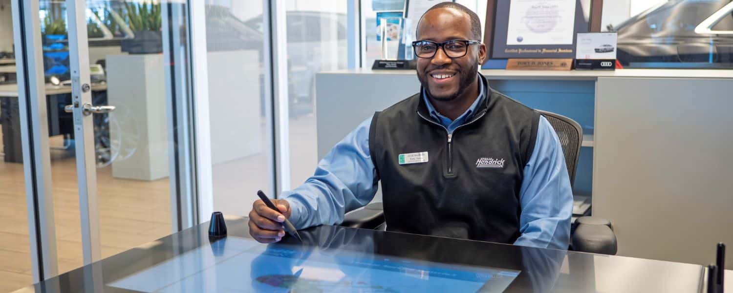 couple signing papers with finance specialist