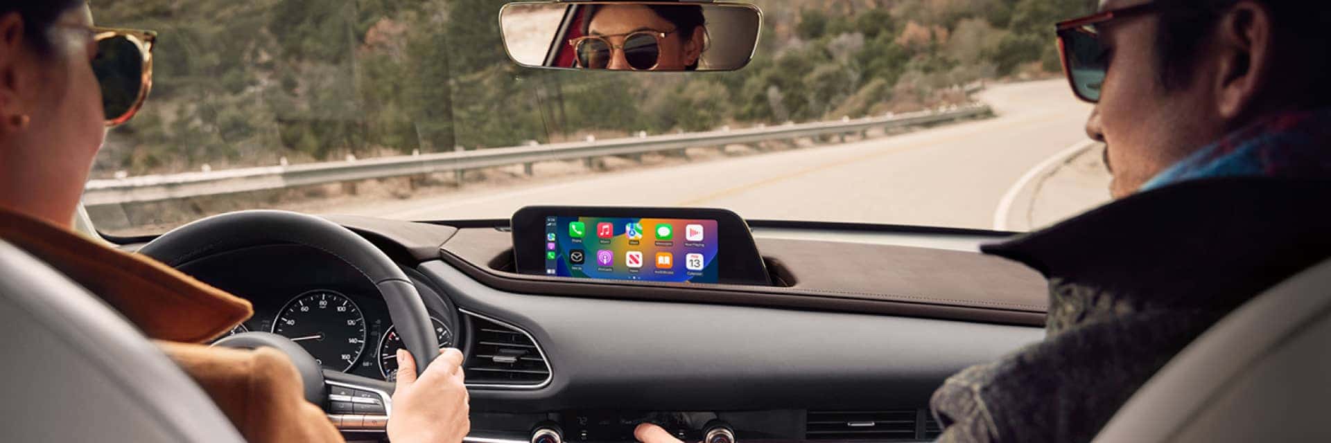 Interior view of the dash of a 2024 Mazda CX-30 with the display showing Apple CarPlay