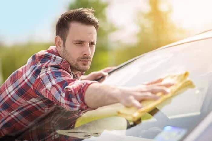 Man_Cleaning_Windshield