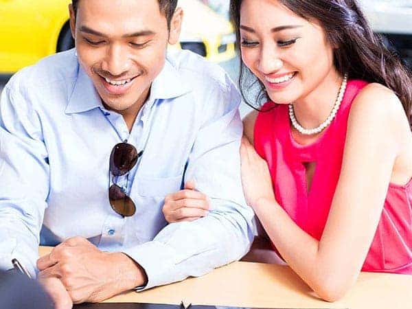 Couple sitting with a salesman