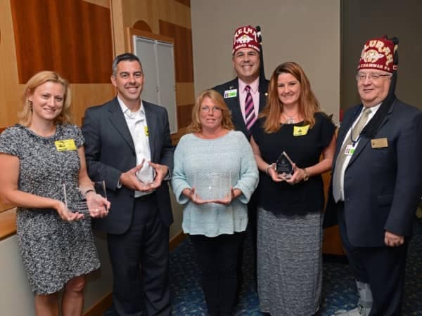 Community Image - Balise Attends Check Presentation for Shriners Hospital Event
