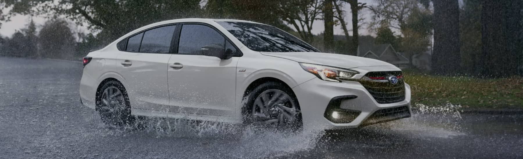 Subaru driving in the rain