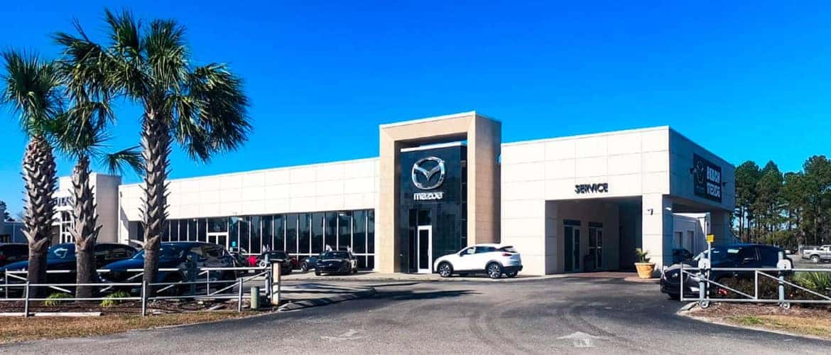 Mazda dealership outside during the day