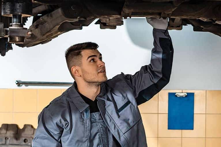 Mechanic reviews a car repair