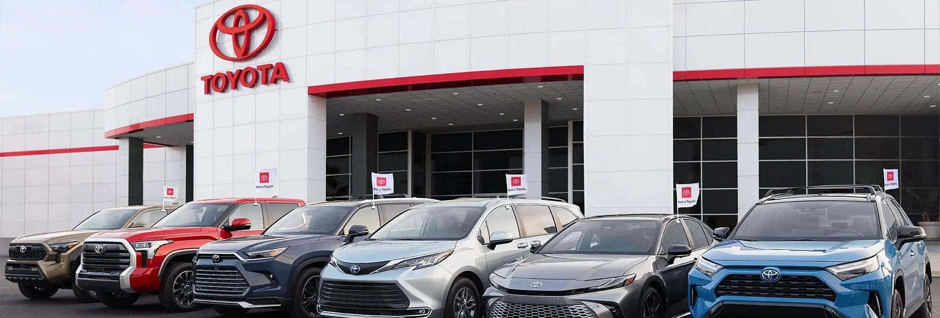 Toyota vehicles parked in front of a building