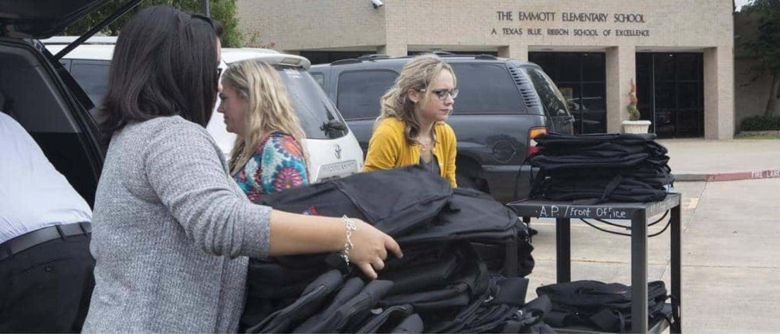 Backpacks being loaded onto carts