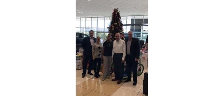 Toys For Tots - group icturei n front of the tree