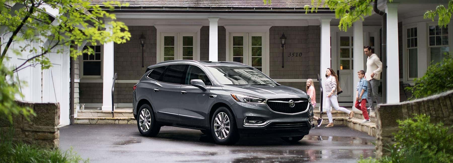 Grey 2020 Buick Enclave in Front of a House