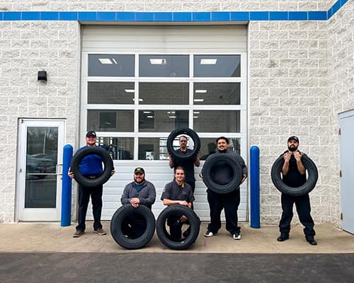 Berger employees with tires
