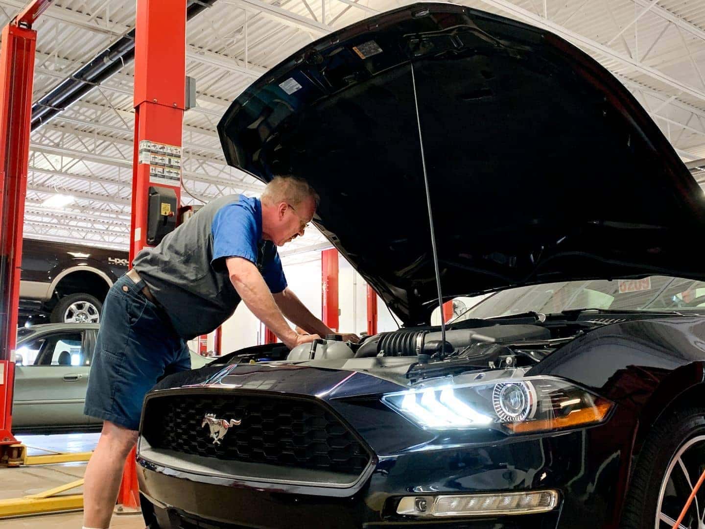 Bill Brown Technician inspecting vehicle