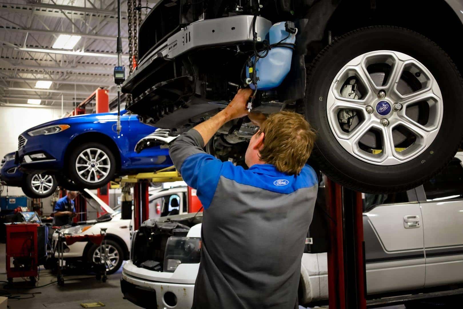 Bill Brown Technician inspecting vehicle