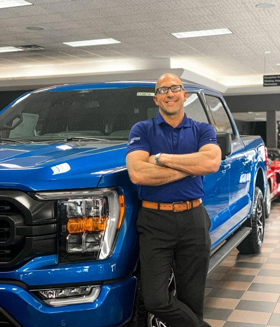 Bill-Brown-Staff-Member-Showing-off-F150-features-to-customer