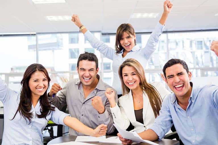 smiling men and women in collared shirts
