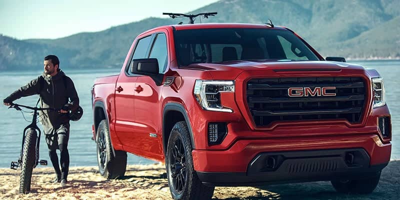 2021-GMC-Sierra-1500-with-a-person-pushing-a-bike