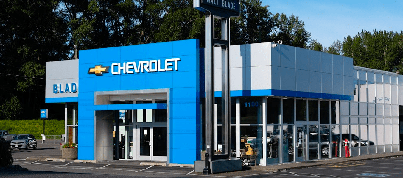 An exterior shot of a Chevrolet dealership during day.