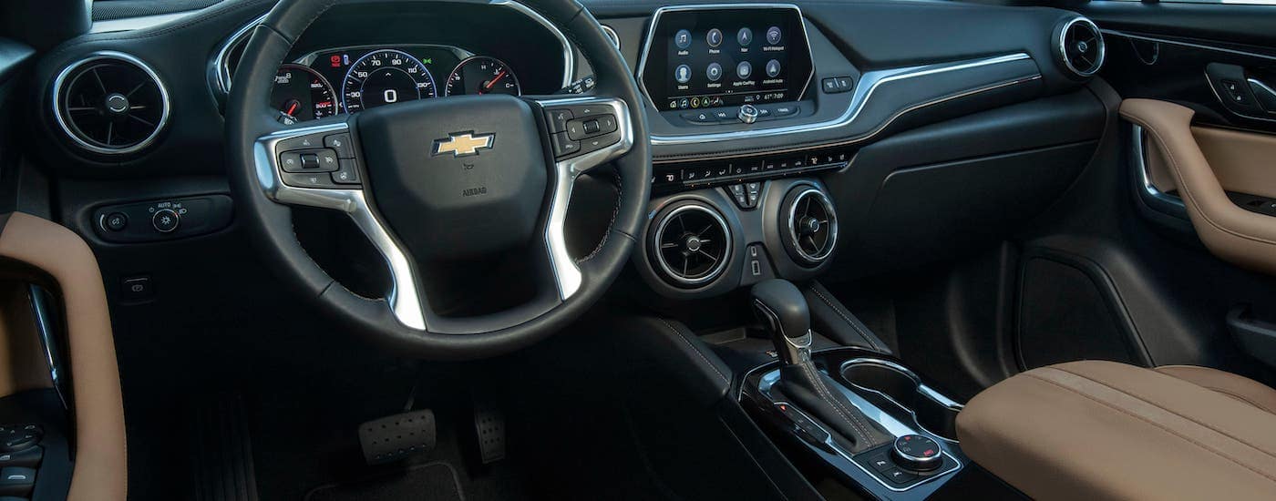 The brown and black interior of a 2019 Chevrolet Blazer from Blossom is shown.