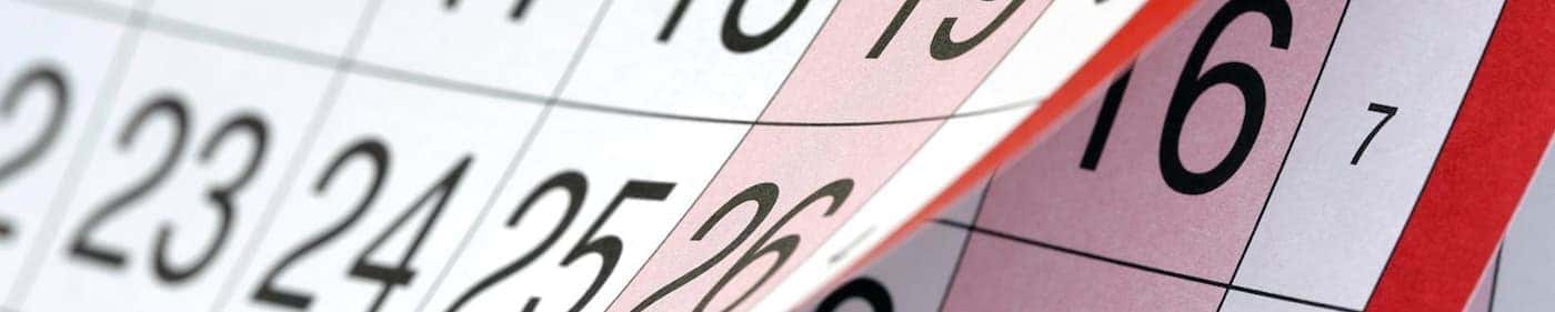 Pages of a calendar are being flipped.