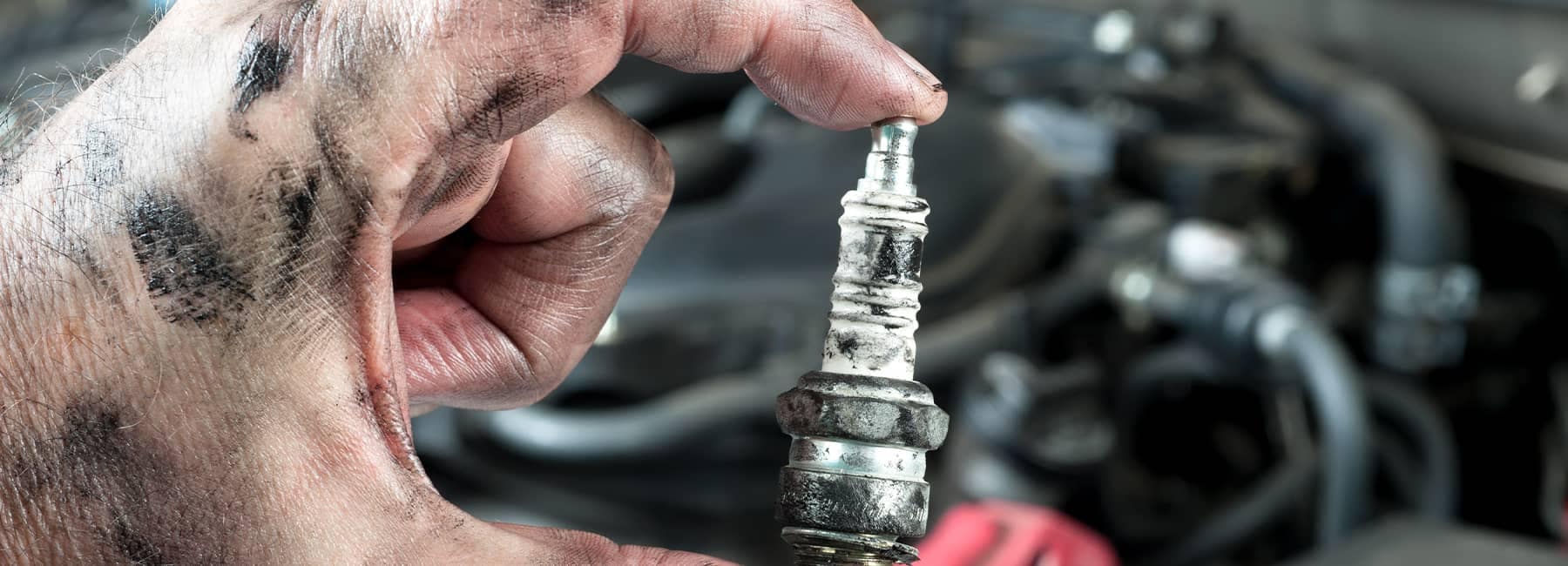 Mechanic holding a spark plug