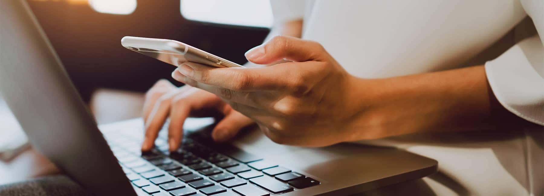 filling out information on phone and computer