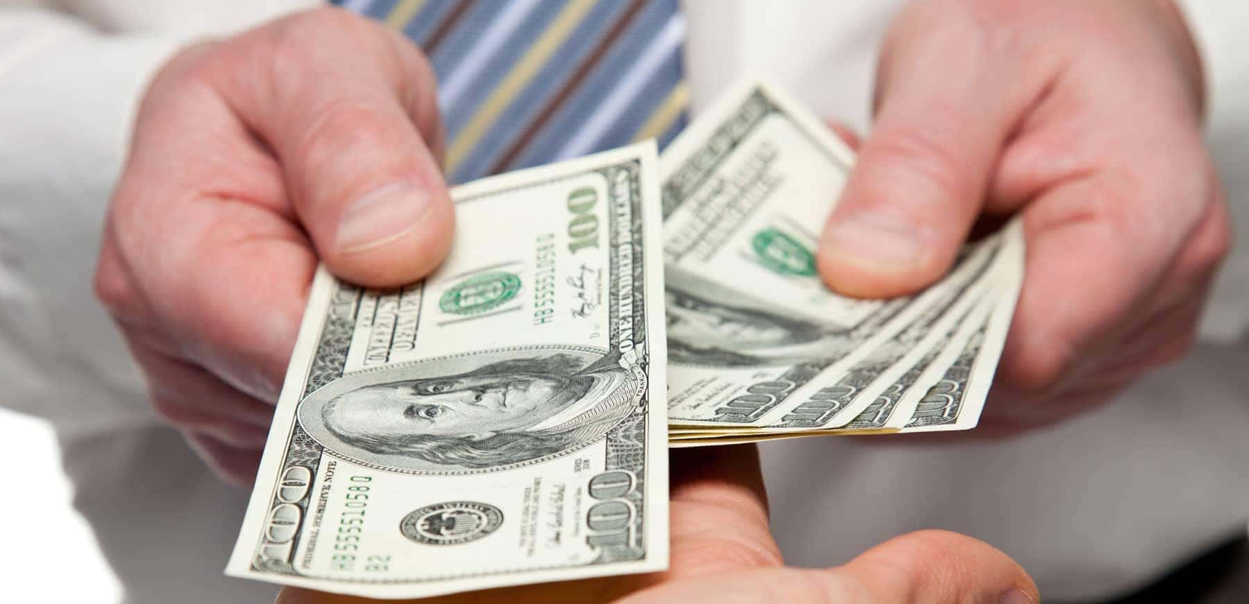 handing over cash