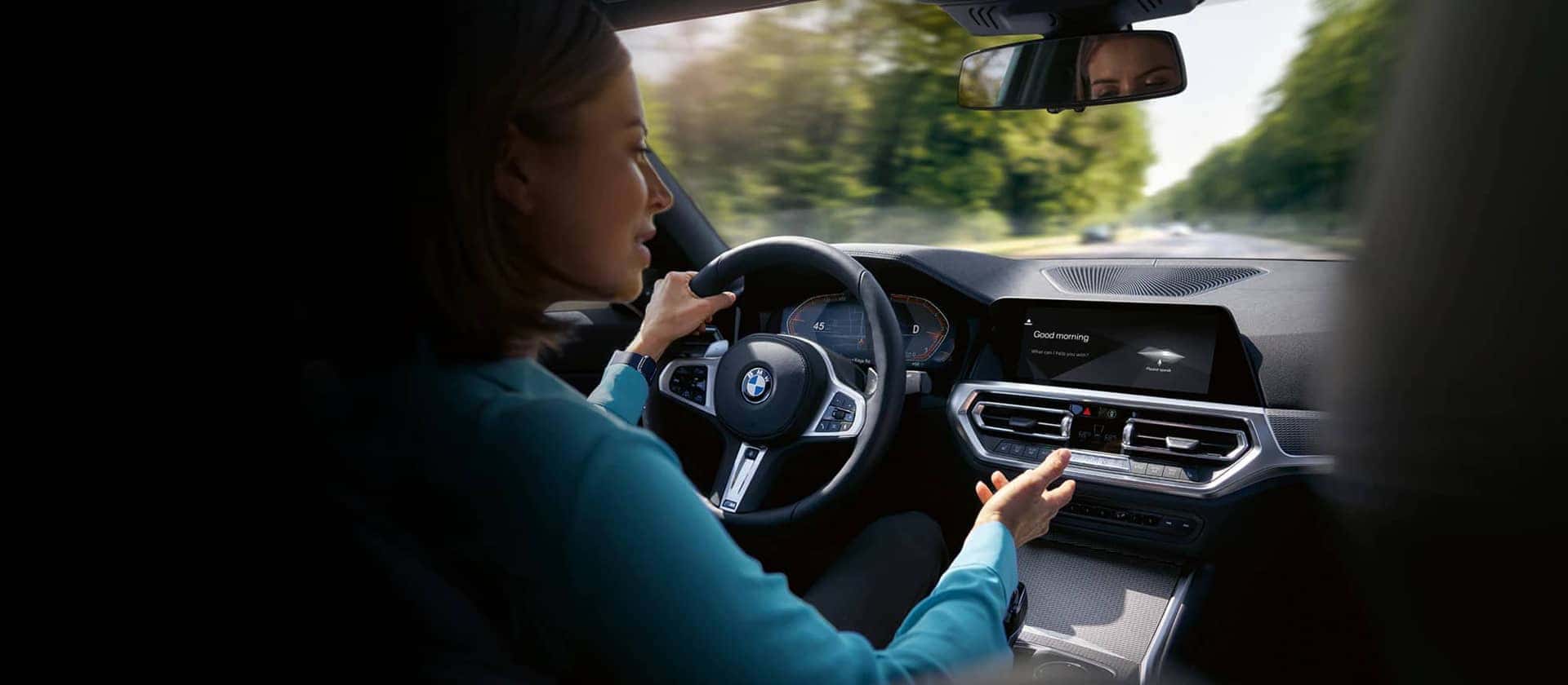 BMW Encore Genius - Woman driving a BMW