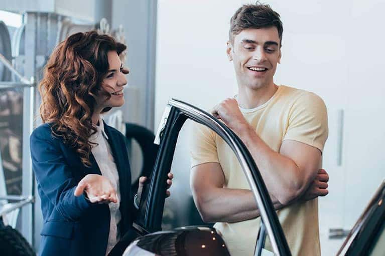 Car saleswoman and customer review car details