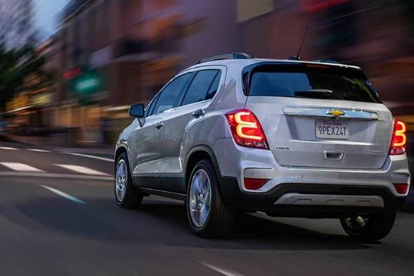 Silver 2020 Chevrolet Trax Driving on a City Rd_mobile