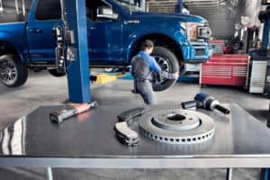 Mechanic Putting Tire on Ford F-150