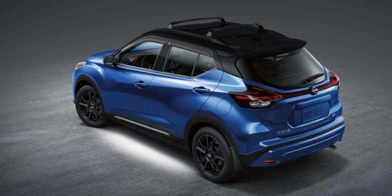 Rear angled view of a blue 2023 Nissan Kicks