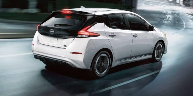 Rear angled view of a white 2023 Nissan LEAF