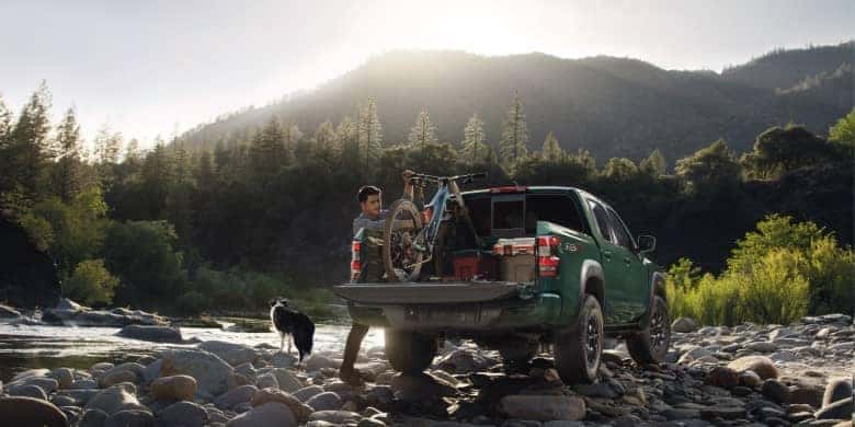 Rear view of a green 2023 Nissan Frontier