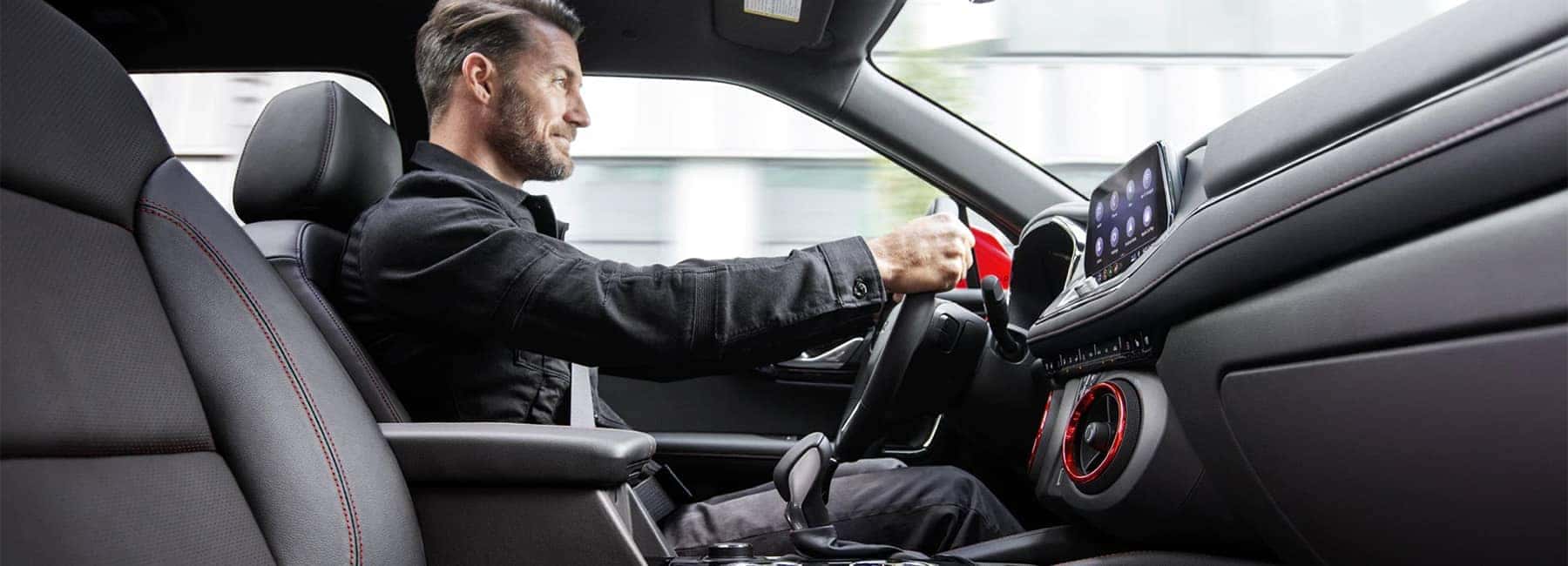 Man in Drivers Seat of 2020 Chevrolet Blazer Jet Black Leather Interior