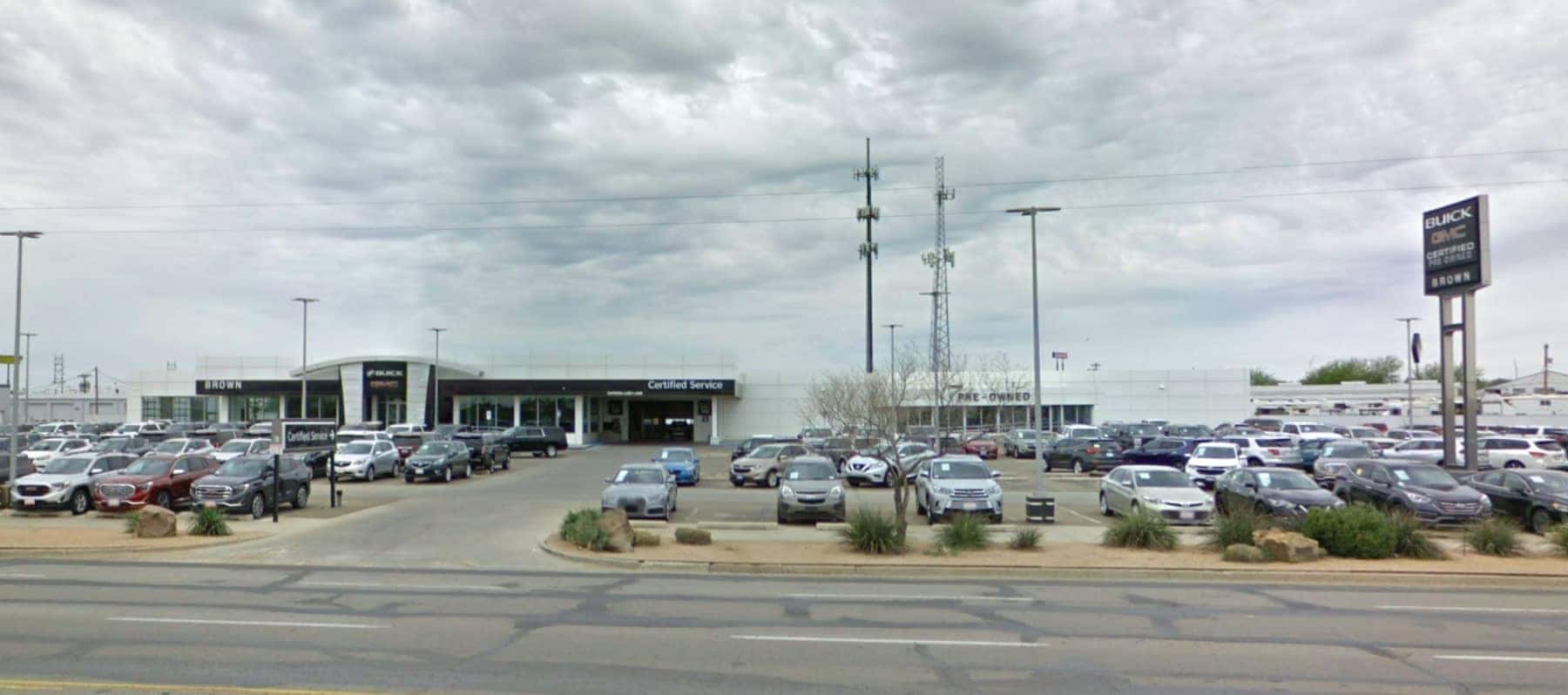 An exterior shot of a Brown Buick GMC dealership.