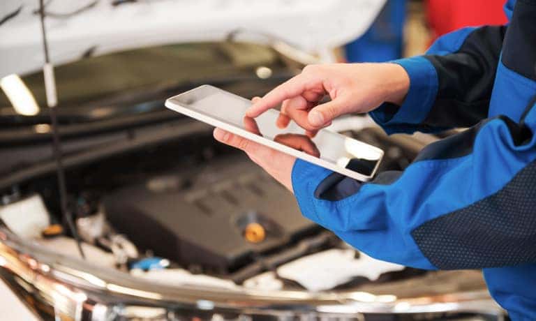 A mechanic using an ipad