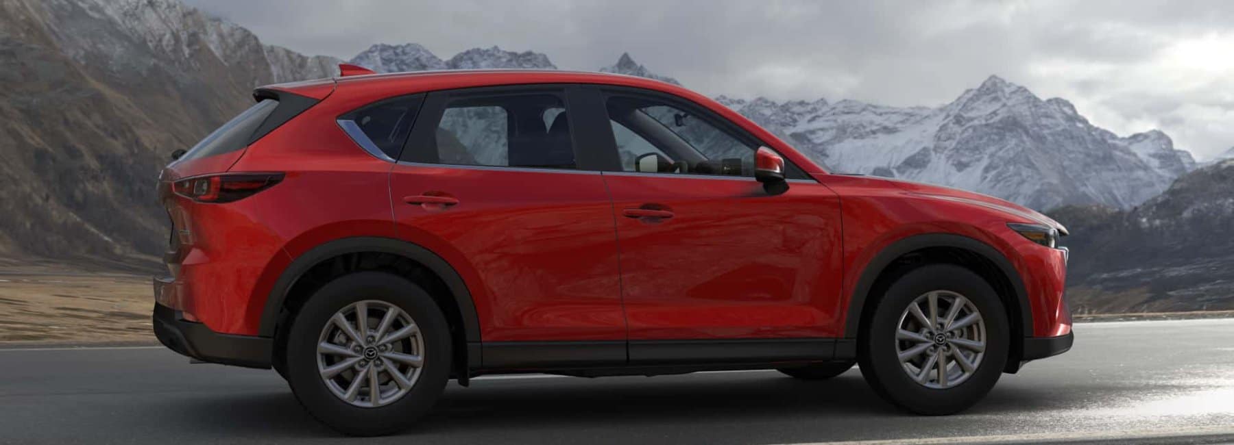 2022 mazda-cx5-sideview-mountain range-background-red