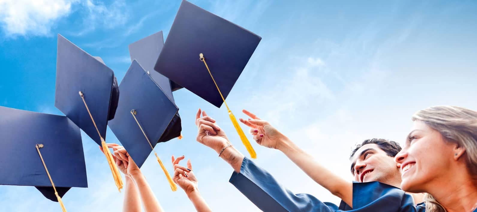 College Graduates Throwing Caps into the Air