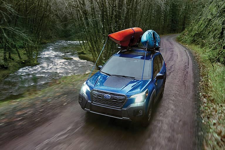 2023 Forester shown in Geyser Blue with accessory